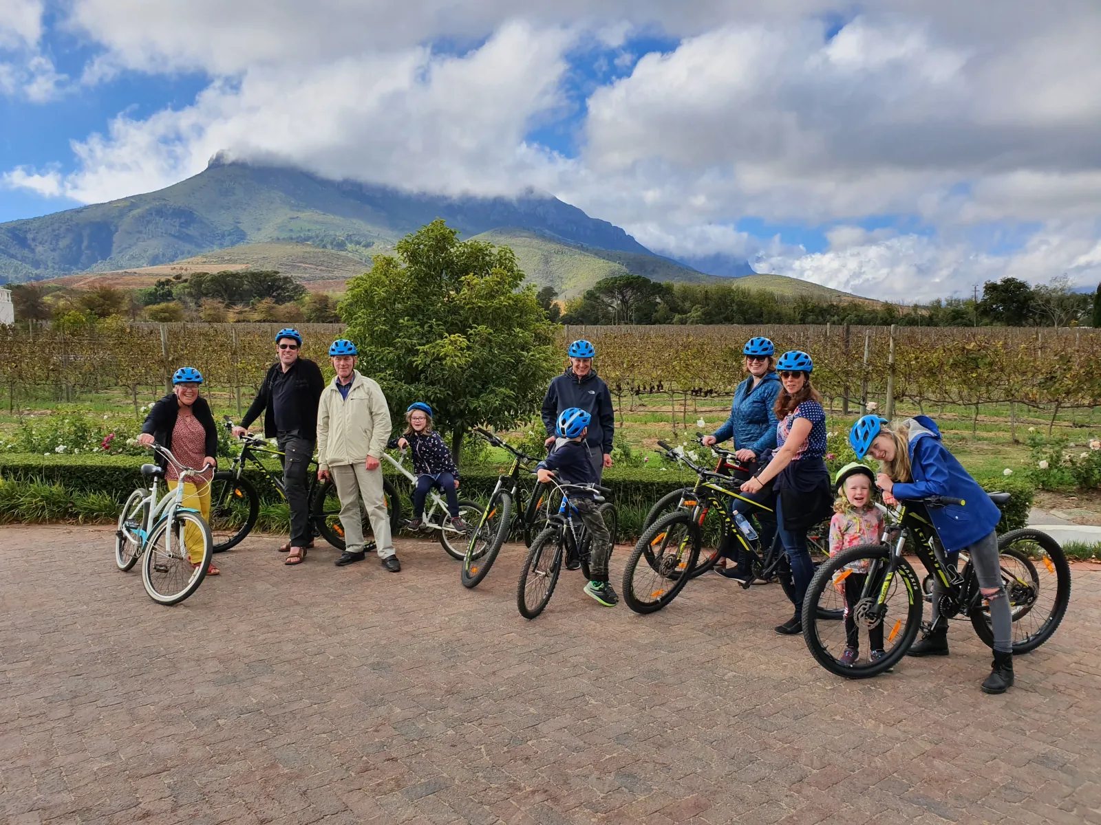 The cycling group with e-bikes on a gravel track below the Jonkershoek mountains